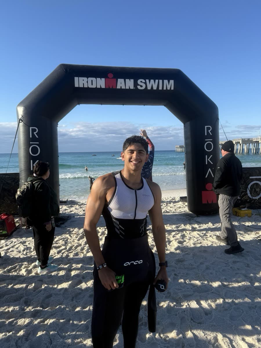 Nirvaan at the Ironman Swim finish arch